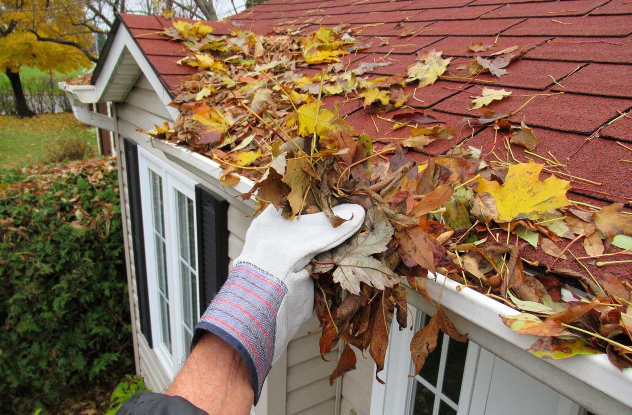 Gutter cleaning tools in use